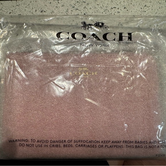 Coach Handbags - Coach Corner Zip leather Wristlet - Powder Pink